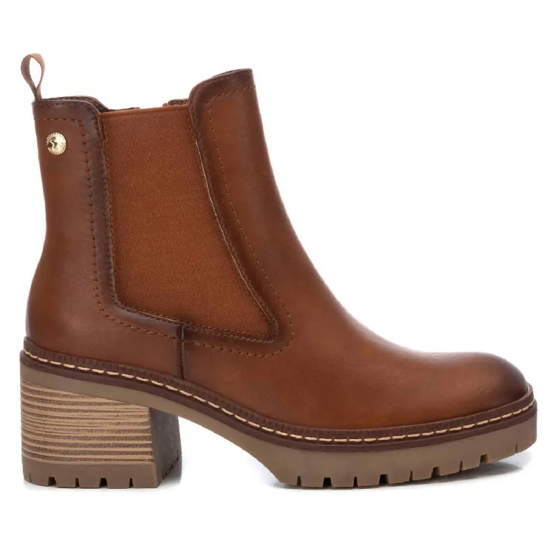 Women's Knee - High Leather Riding Boots in Black for a Classic Equestrian LookWomen's Faux Leather Booties In Camel Women's Knee - High Leather Riding Boots in Black for a Classic Equestrian LookWomen's Faux Leather Booties In Camel