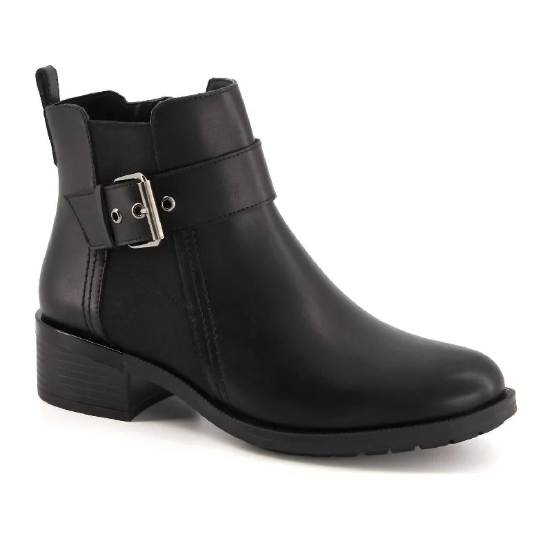 Women's Ankle Boots with Cut - Out Details in Beige for a Unique and Stylish EdgeWomen's Leather Booties With Elastic Side And Buckle In Black Women's Ankle Boots with Cut - Out Details in Beige for a Unique and Stylish EdgeWomen's Leather Booties With Elastic Side And Buckle In Black
